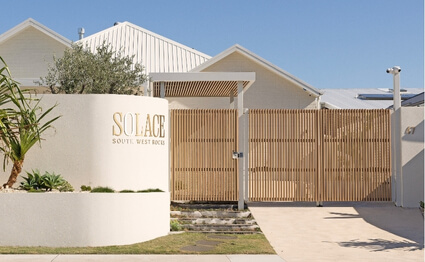 fence and gate with decobatten radius battens by oak and orange