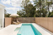 Decobatten square aluminium battens with a timer look finish used as a pool fence.