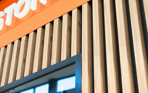 decobatten used as a wall screening in a shopping centre.