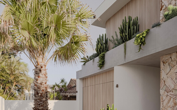 decobatten used as a garage door cover and screening facade.